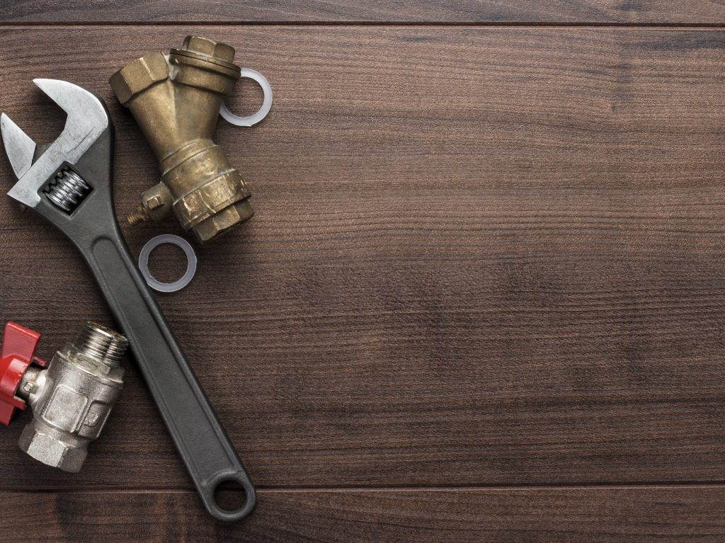 Adjustable Wrench And Pipes